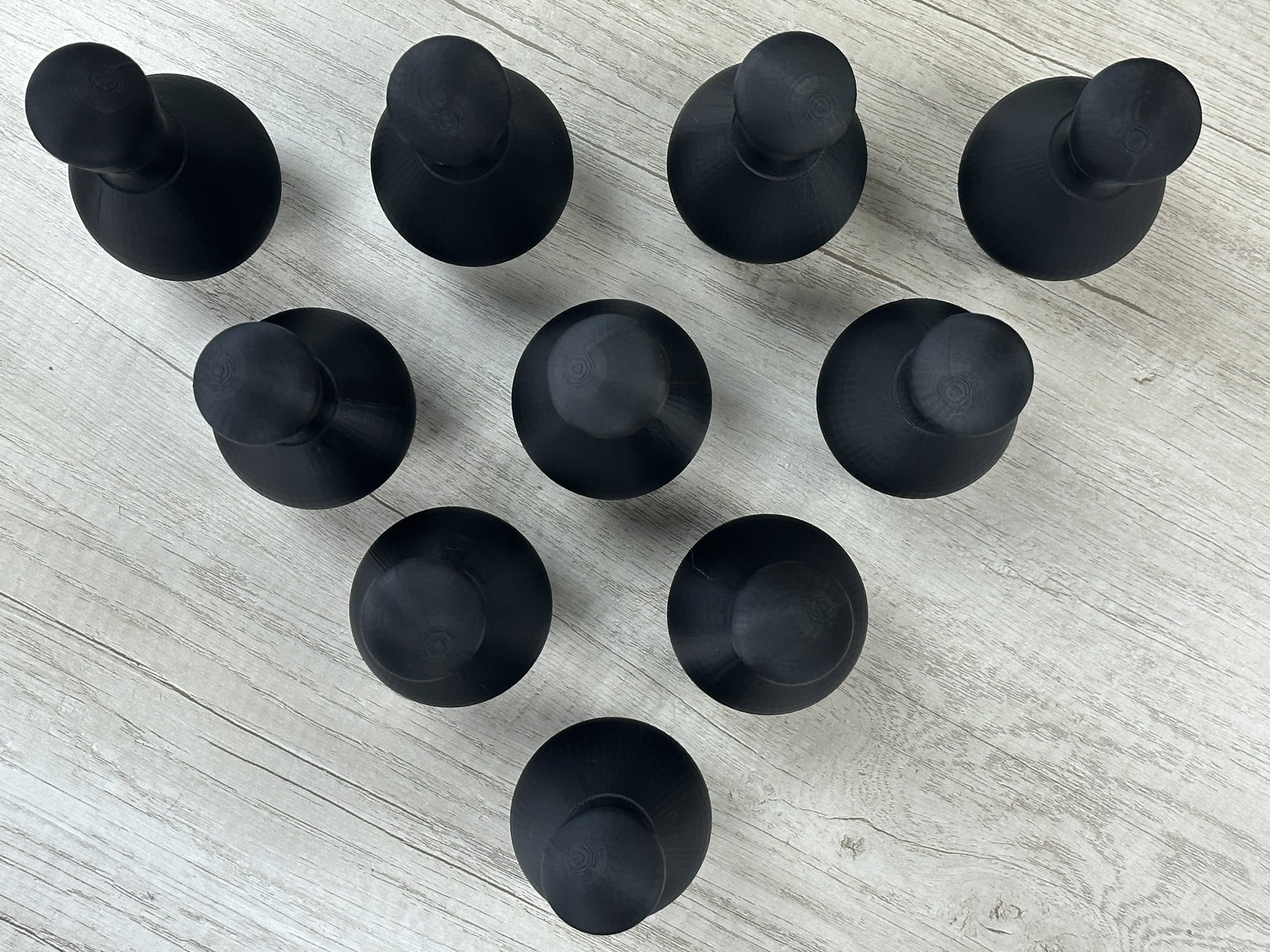 Ten bowling pins arranged in the first physical game state