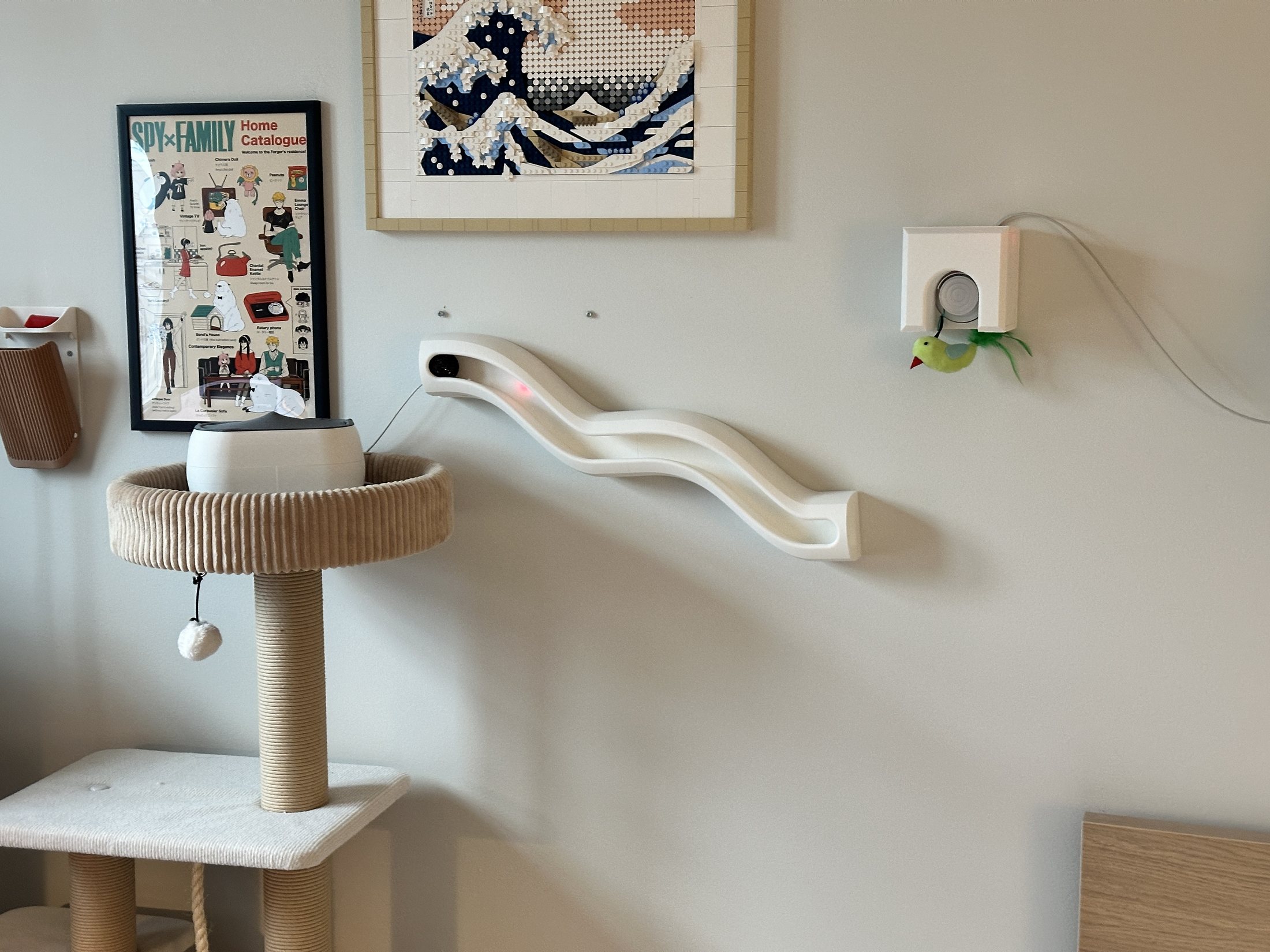 HUNT's three cat enrichment devices installed across a compact apartment wall and window zone