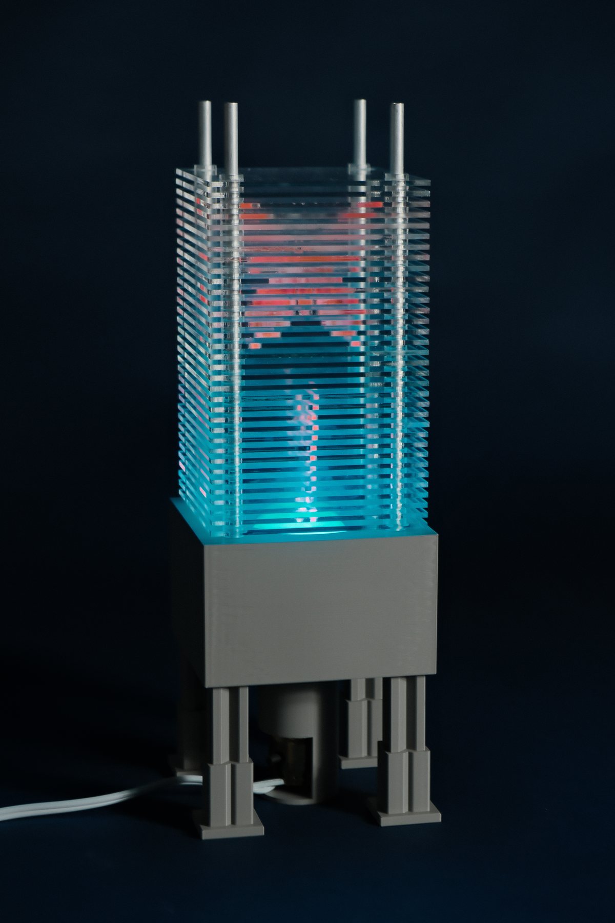Patterned lamp showing cyan and pink illumination