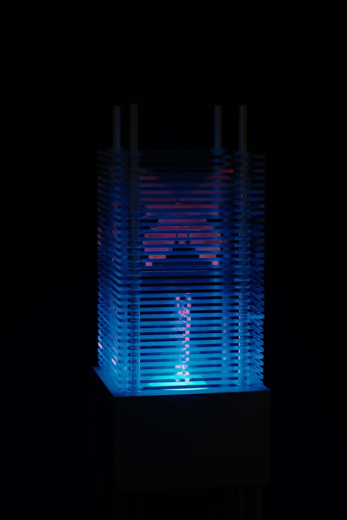 Patterned lamp illuminated in cyan
