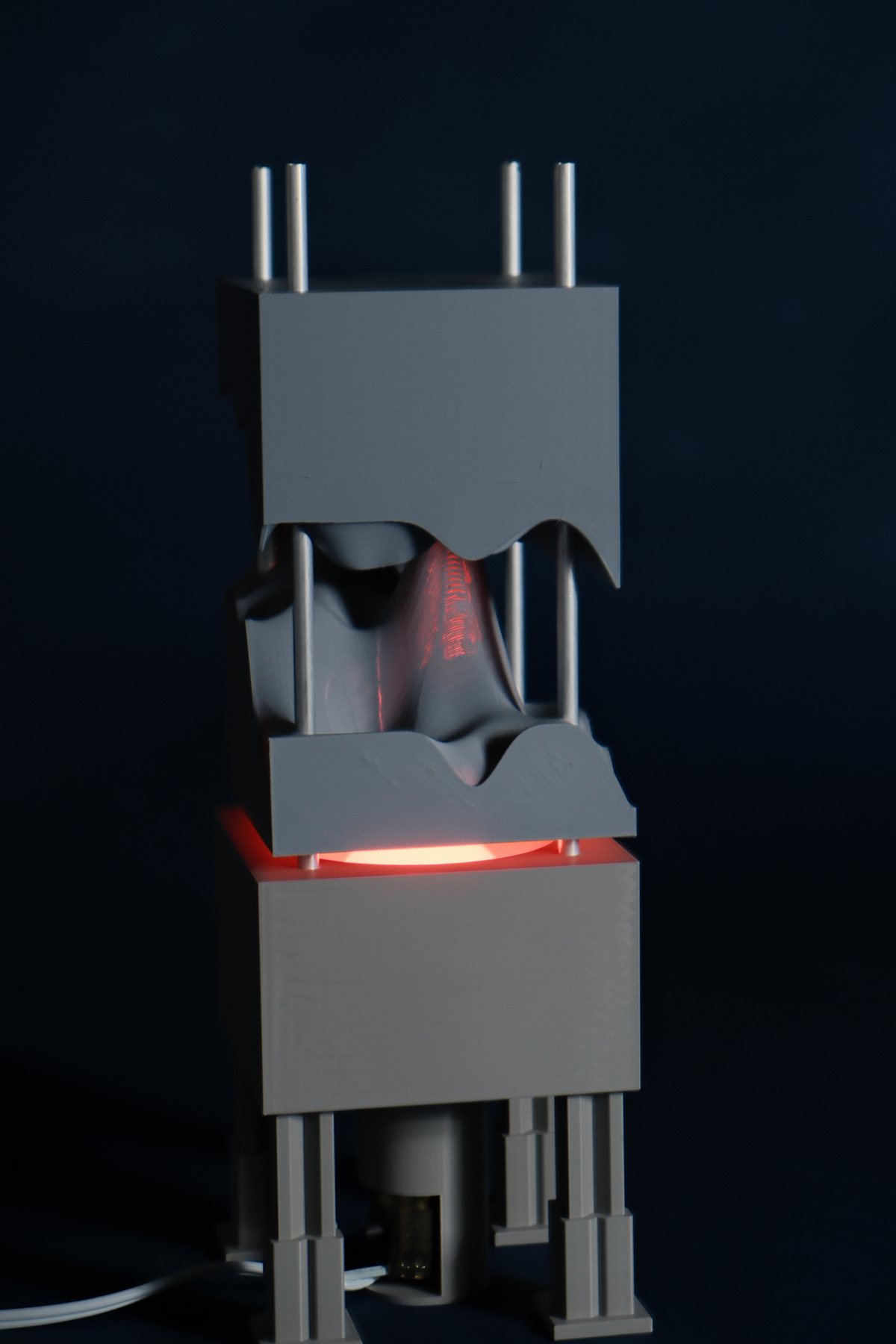 Lamp opened to reveal the removable acrylic pattern stack and central bulb