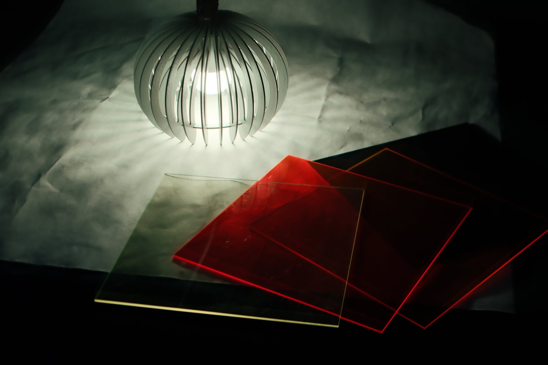 Separate material study showing colored acrylic under one lighting color