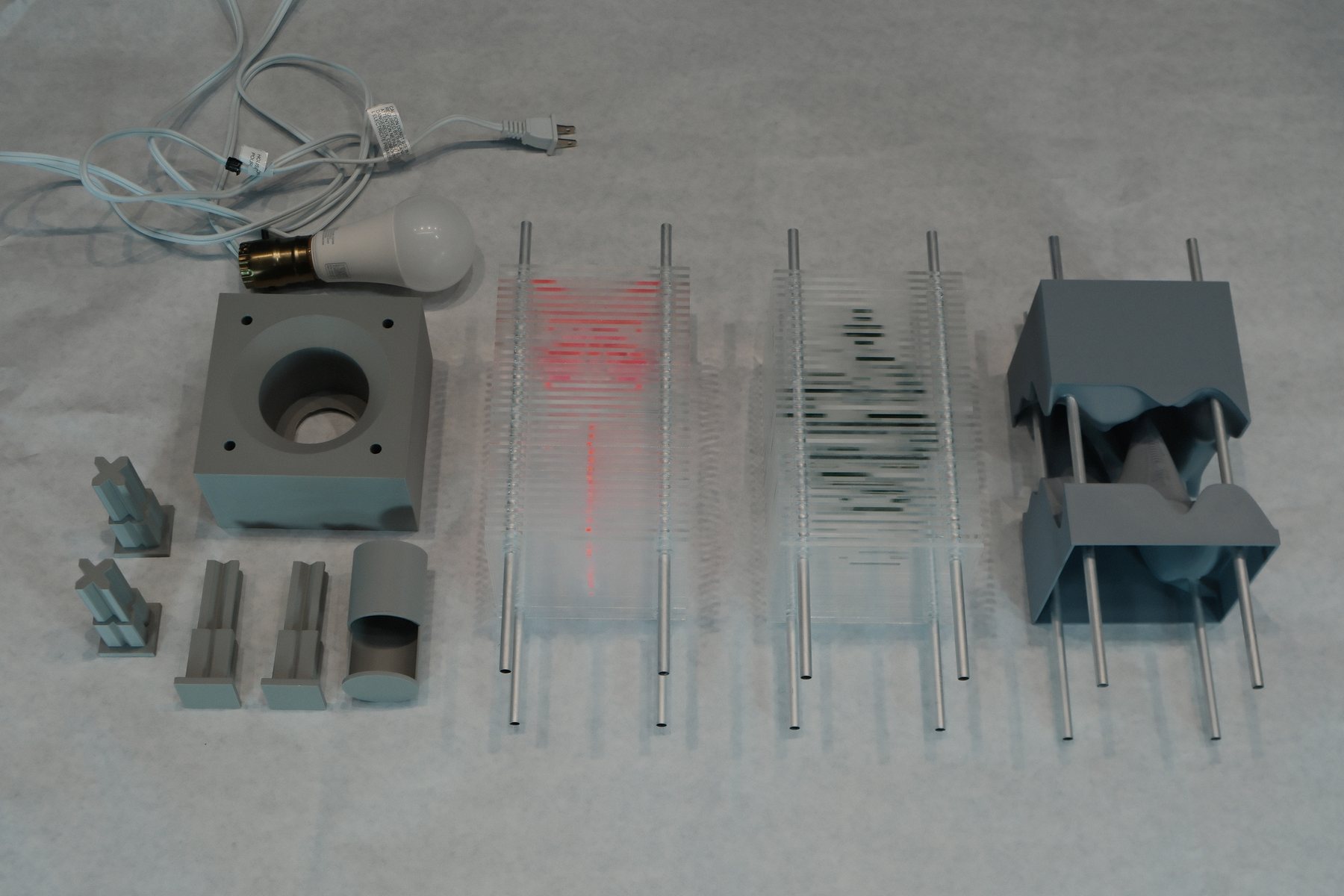 Disassembled lamp showing the frame and acrylic pattern components