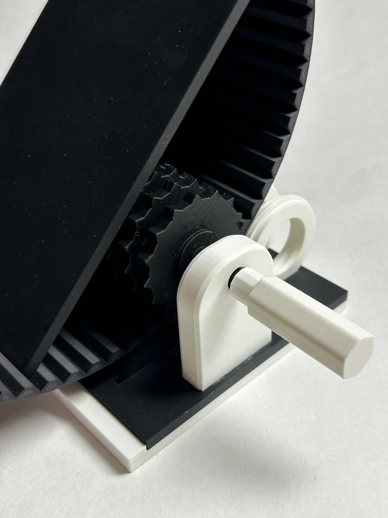 Close view of the side crank and toothed components