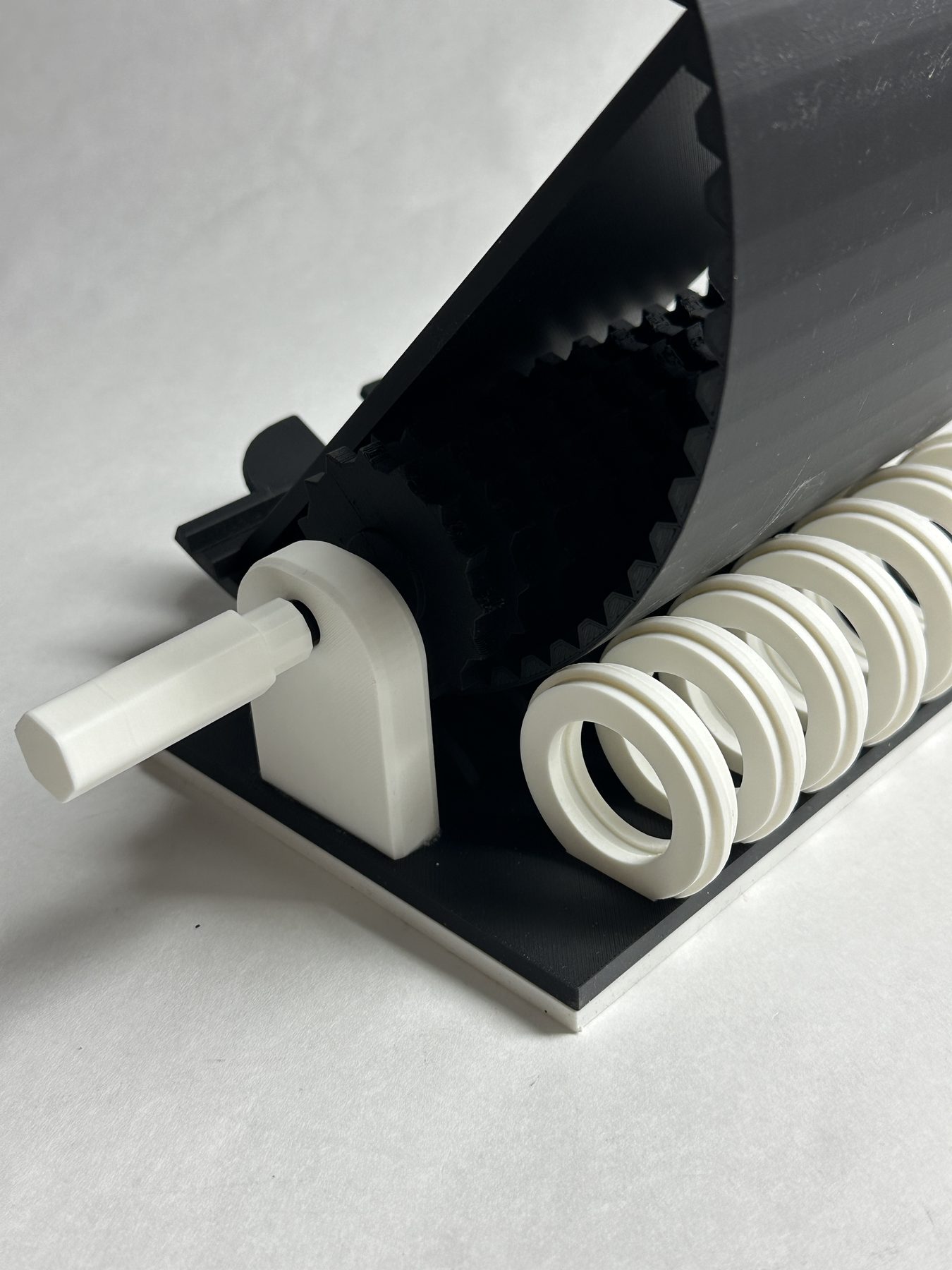 Close view of the toothed platform interface and ringed side grip