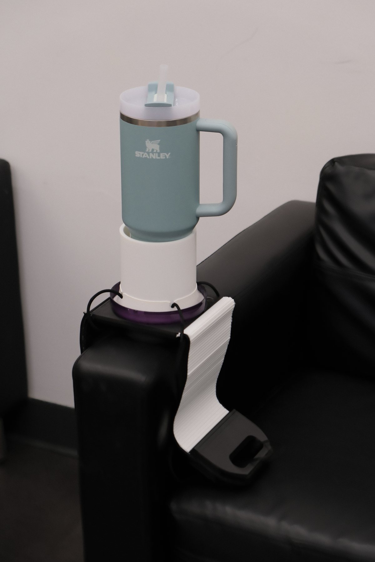 Stanley tumbler held by the Sofa Balancer accessory system